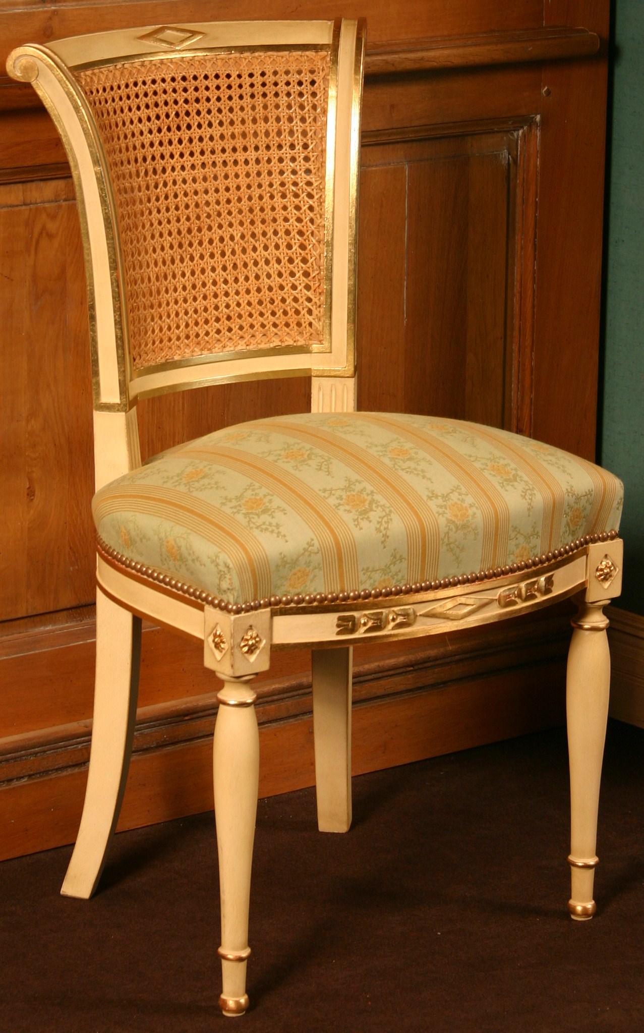 Chaise, en bois de hêtre, à dos canné,en crosse à tableau incurvé
